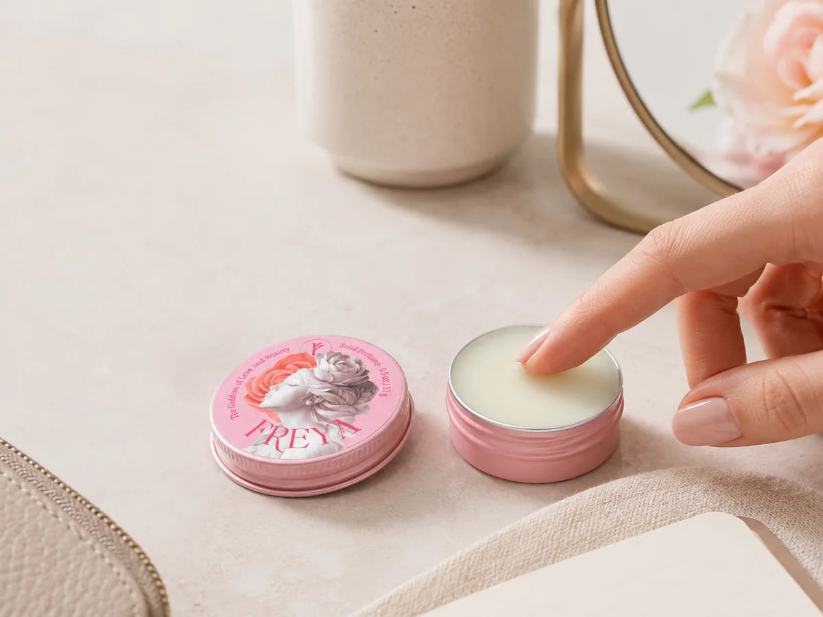 Freya solid fragrance warmed with a fingertip in an open tin
